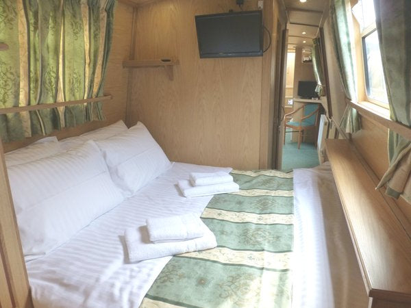 Example Elite narrowboat bedroom with a double bed.