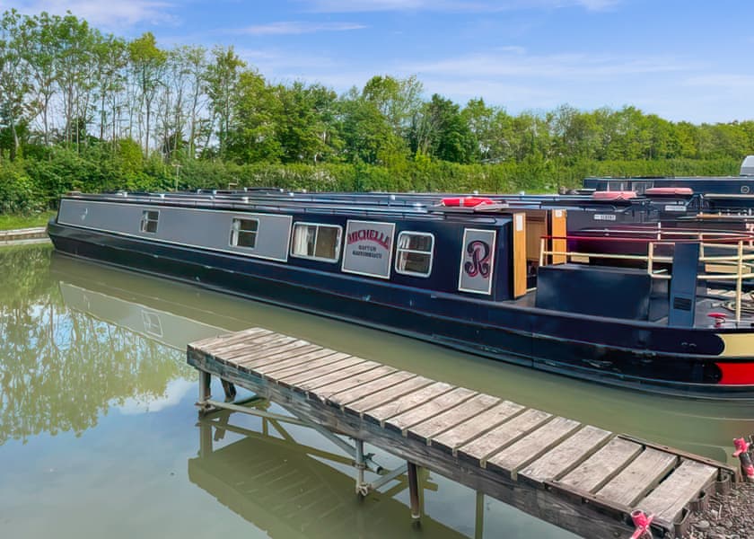 Michelle, an Elite Regency 8 narrowboat, moored on the canal.